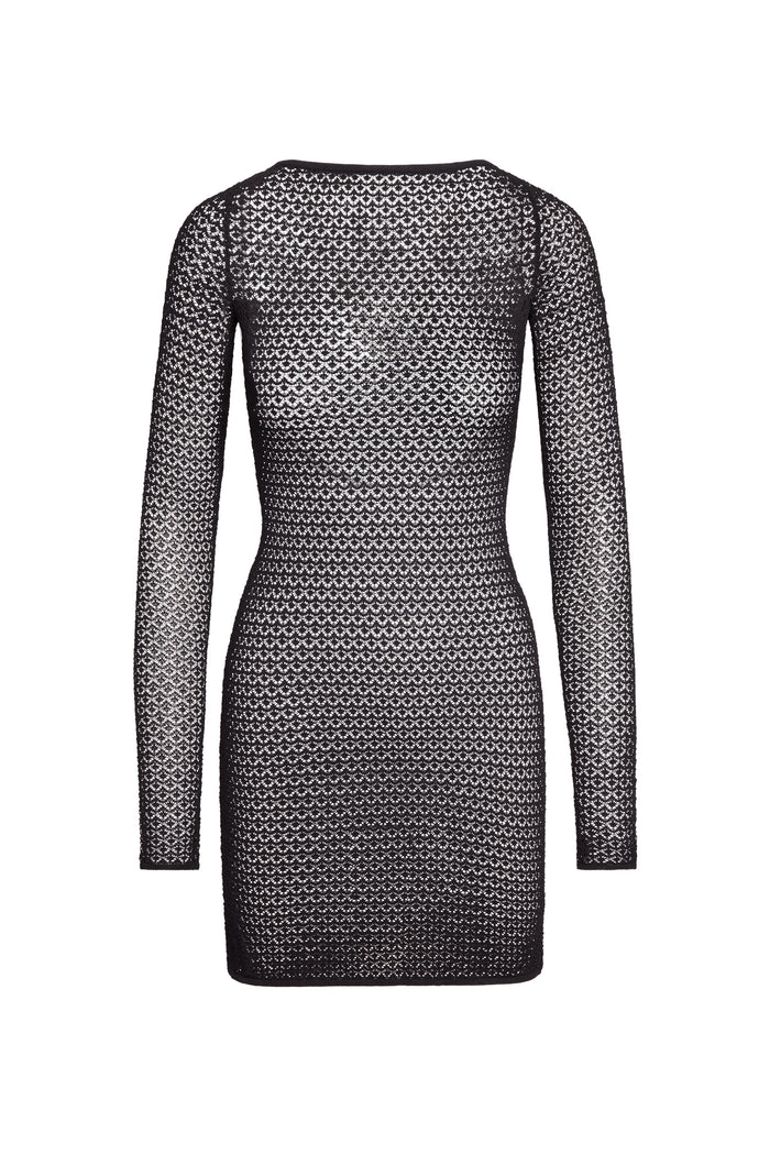 Back view of Bodrum Mini Dress in black lace crochet showing long sleeves, fitted waist, and open knit on white background