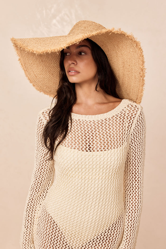 Three-quarter view of Bondi Hat - Wide Brim showing 5.5-inch frayed brim and braided straw texture on neutral background