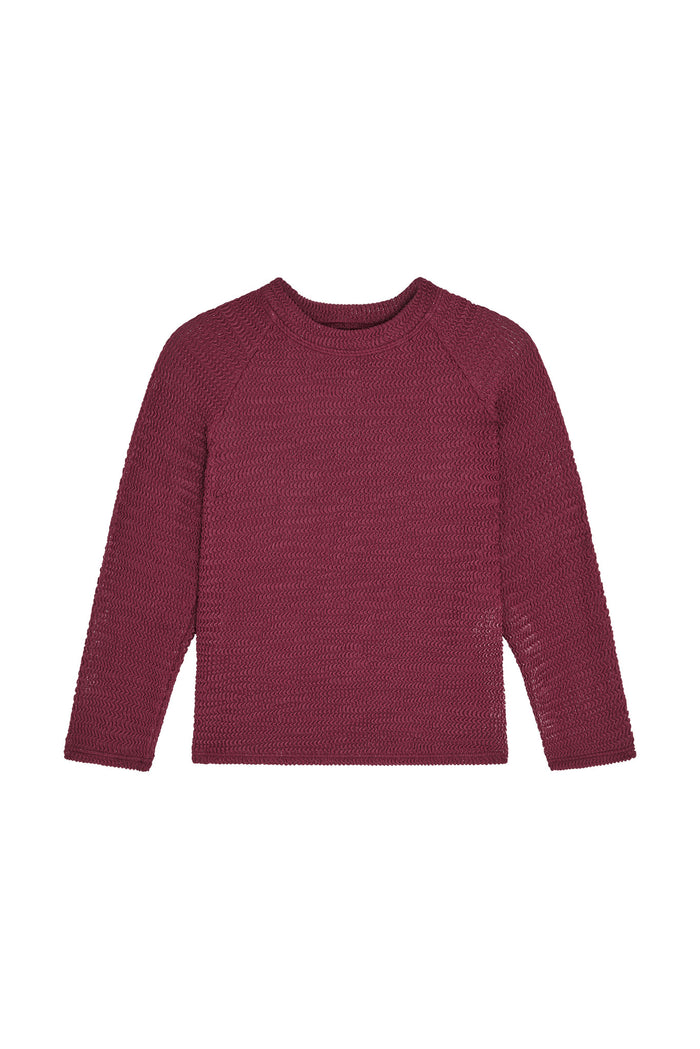 Front view of Bondi kids rashguard in fig crinkle showing textured fabric, long sleeves and crew neckline on white background