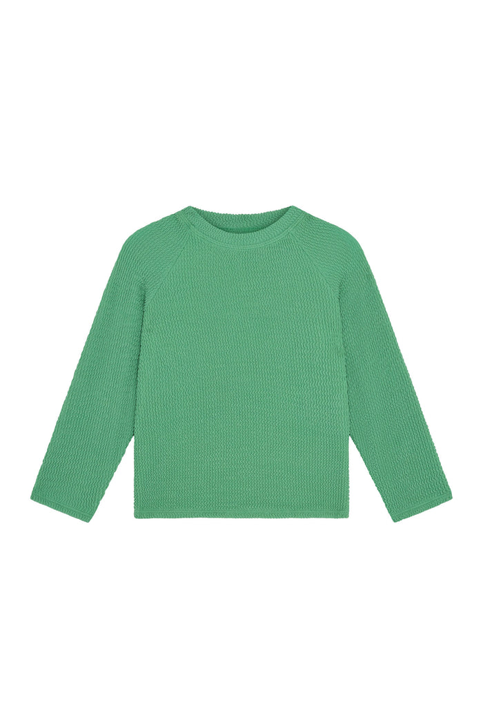 Front flat lay of Bondi Rashguard Kids in Pond Crinkle showing long sleeves and textured crinkle fabric on white background