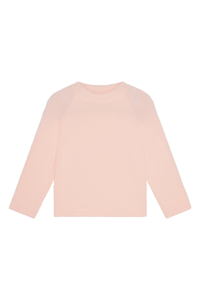 Front flat lay of Bondi Rashguard Kids in powder pink crinkle showcasing long sleeves, textured crinkle fabric and crew neckline on white background