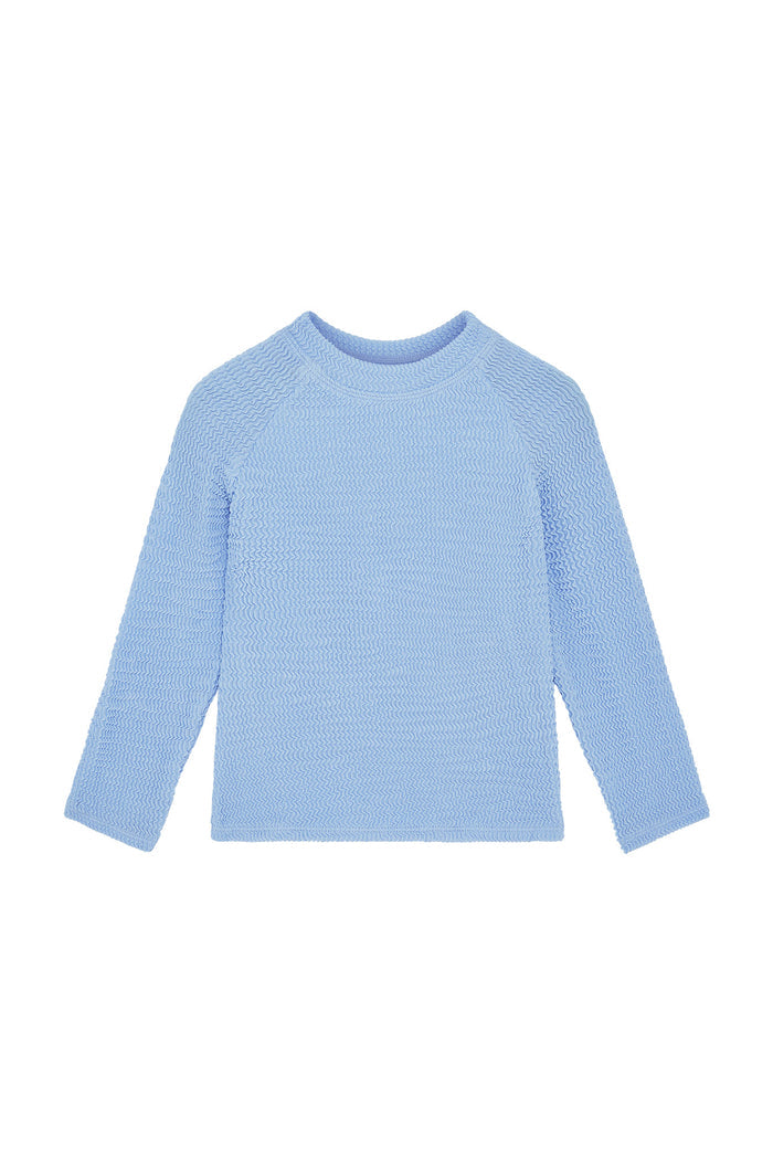Front view of Bondi kids rashguard in Sky Crinkle showcasing textured crinkle fabric and long sleeves on white background