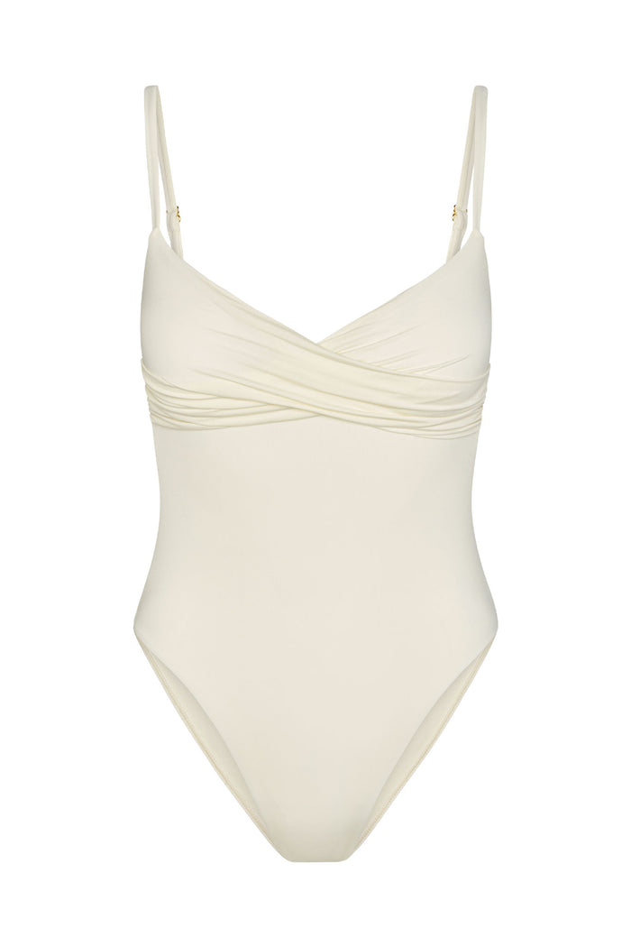 Ivory one-piece swimsuit with ruched crossover bust, adjustable thin shoulder straps, high-cut leg openings.