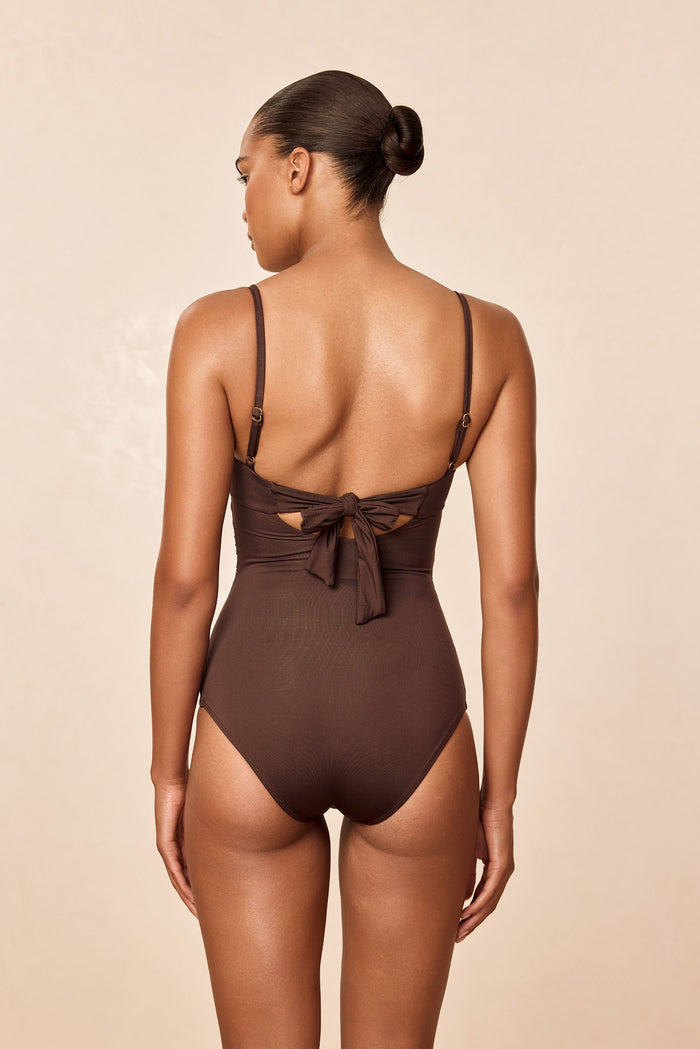 Back view of Bordeaux One Piece full-coverage swimsuit with adjustable straps and tied back in espresso