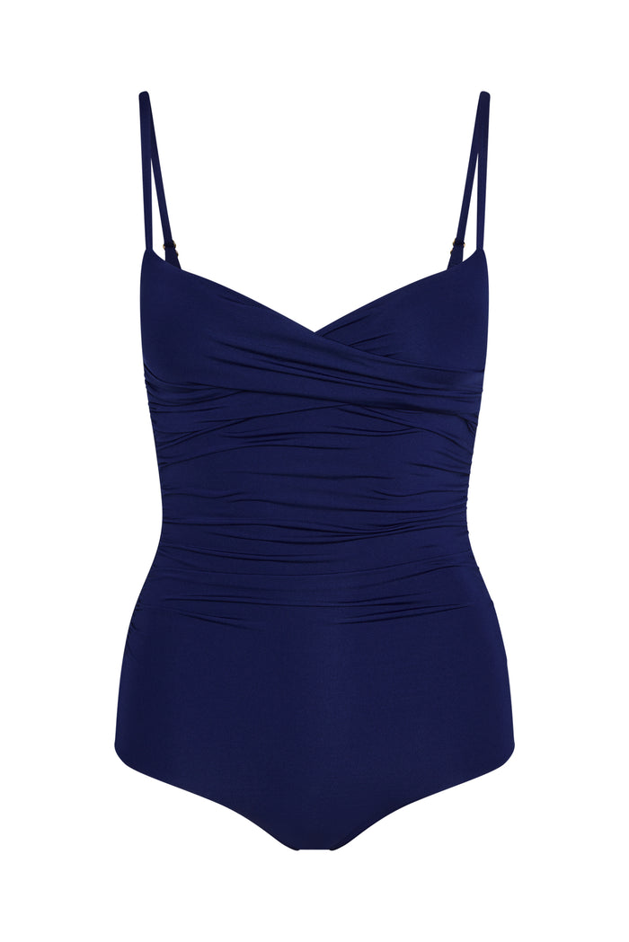 Front of Bordeaux one-piece swimsuit in Midnight with crossover neckline, adjustable straps and ruched torso on white