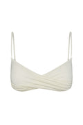 Close-up front view of Bordeaux Top in ivory showcasing wrap-front twist, thin adjustable spaghetti straps and fitted underband on white background