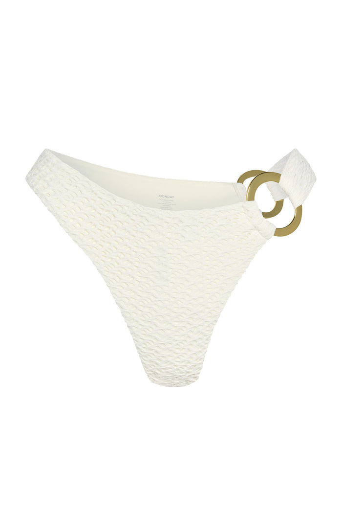Front view of Bronte Bottom in Ivory Crochet showcasing textured crochet fabric and gold-tone double ring side hardware on white background