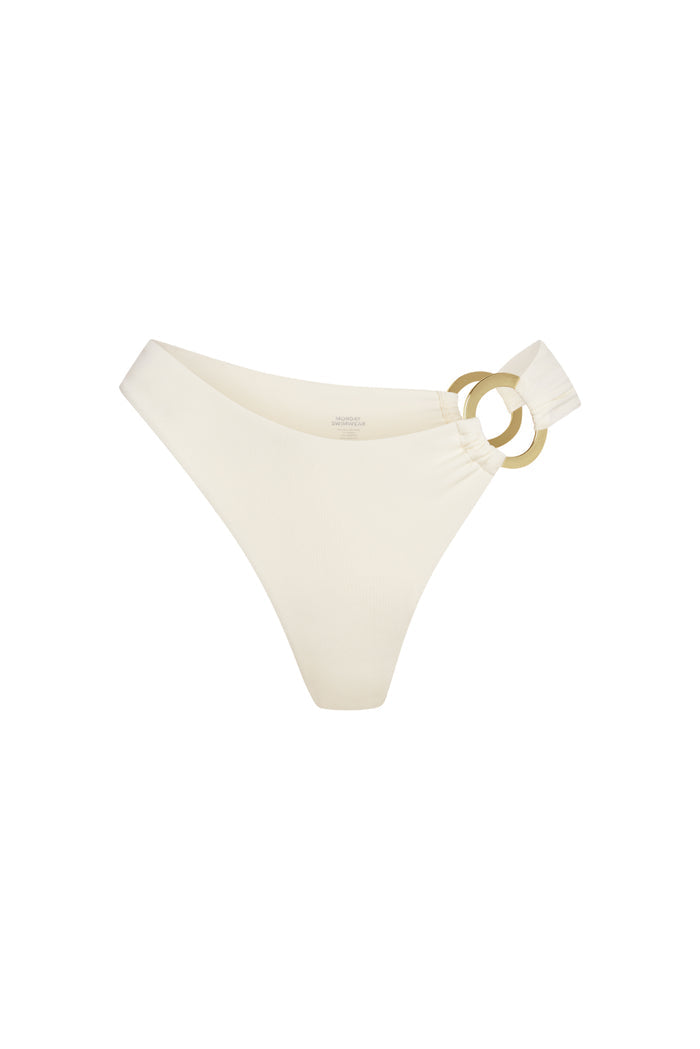 Front view of Bronte bottom in ivory showcasing gold side rings with white background