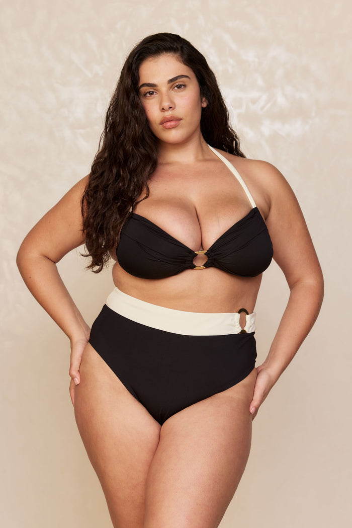 Front view of Bronte Top in Black/Ivory showcasing halter strap and gold center ring on neutral studio background