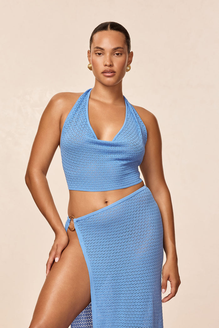 Front view of Bula cowl neck top in Azure Lace Crochet showing draped cowl neckline, halter ties and crochet texture
