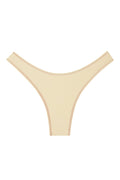 Front of Byron Bottom in Champagne Denim, mid-rise high-cut thong with contrast topstitching on white background