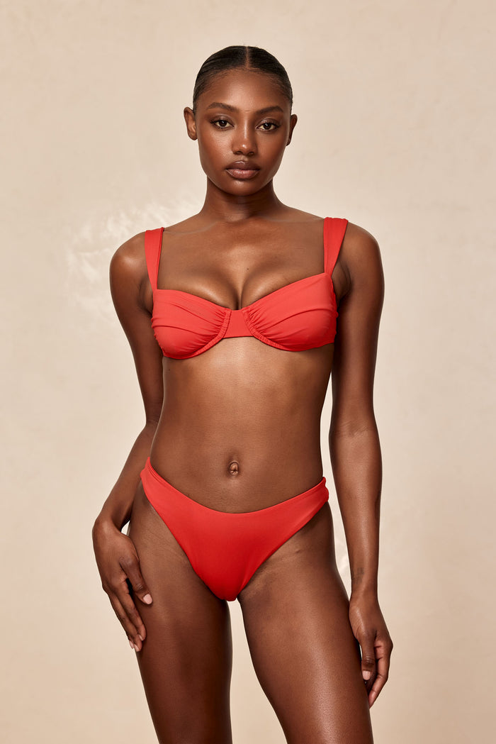 Front of Malibu Top in Chili Pepper showing ruched underwire cups and adjustable shoulder straps on a neutral beige background