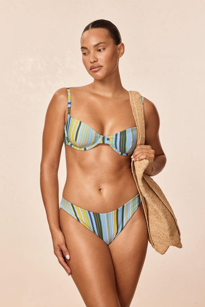 Front view of Byron Bottom in Sardinia Stripe Azure showcasing mid-rise fit and multicolor stripes on model