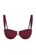 Front view of Cala Roja Top in Fig showcasing balconette underwire cups and thin adjustable straps on a white background
