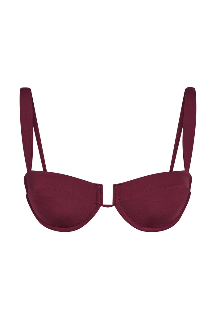 Front view of Cala Roja Top in Fig showcasing balconette underwire cups and thin adjustable straps on a white background