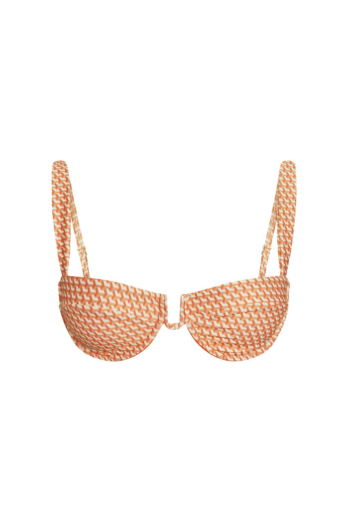 Front view of Cala Roja top with underwire balconette cups, adjustable straps, orange micro-geo pattern on white background