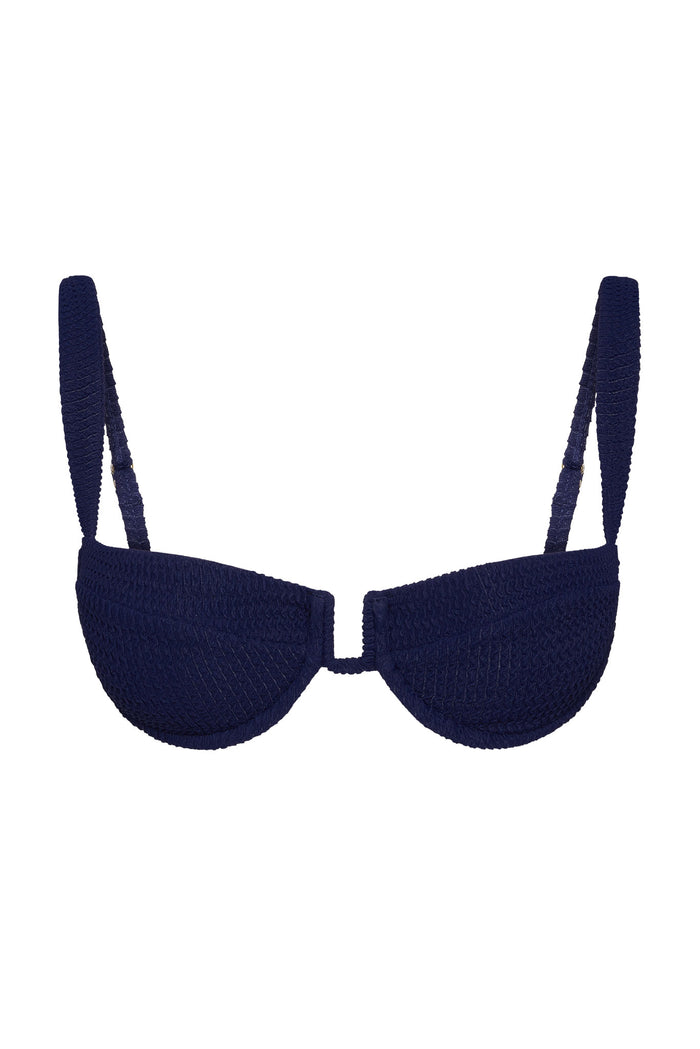 Front view of Cala Roja bikini top in Midnight Crinkle with underwire cups and adjustable straps on white