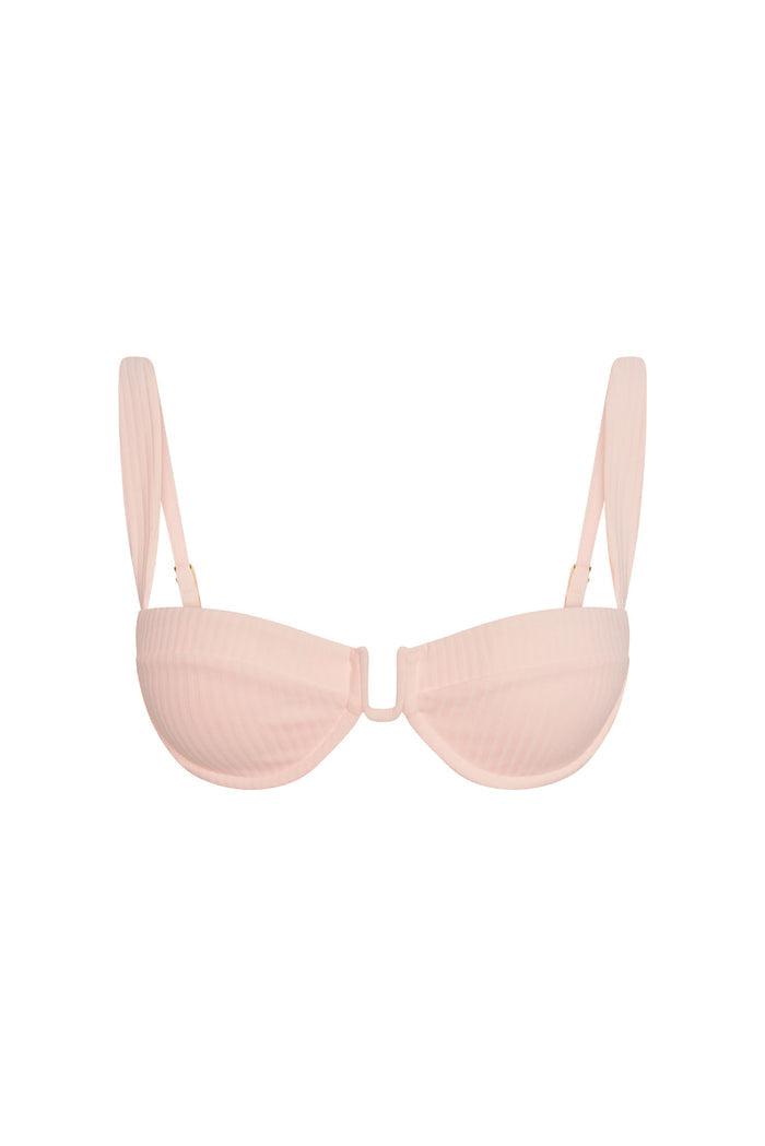 Front view of Cala Roja Top in powder pink rib showing U-shaped center, underwire cups and adjustable straps on white