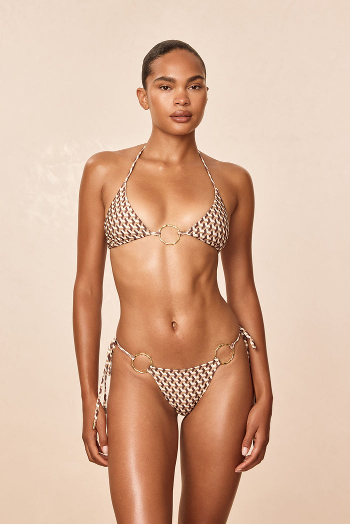 Front view of Cannes Top in Husk Geo showcasing halter cups, gold center ring and adjustable ties on a neutral background