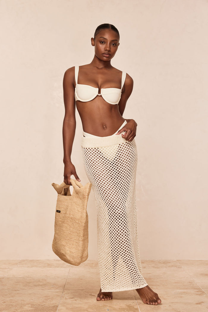 Front view of Cape May skirt in ivory crochet on model showcasing high-waist open-knit maxi design with neutral studio background