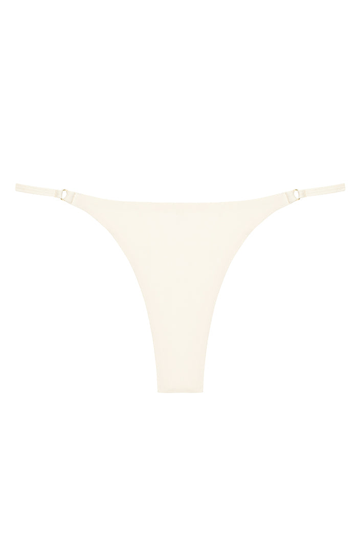 Front view of Capri Bottom in ivory showing thong cut, high-leg silhouette, adjustable side straps and gold rings on white