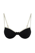 Front close-up of Capri Top in Black/Ivory showcasing underwire molded cups, ivory contrast trim and adjustable straps on white background