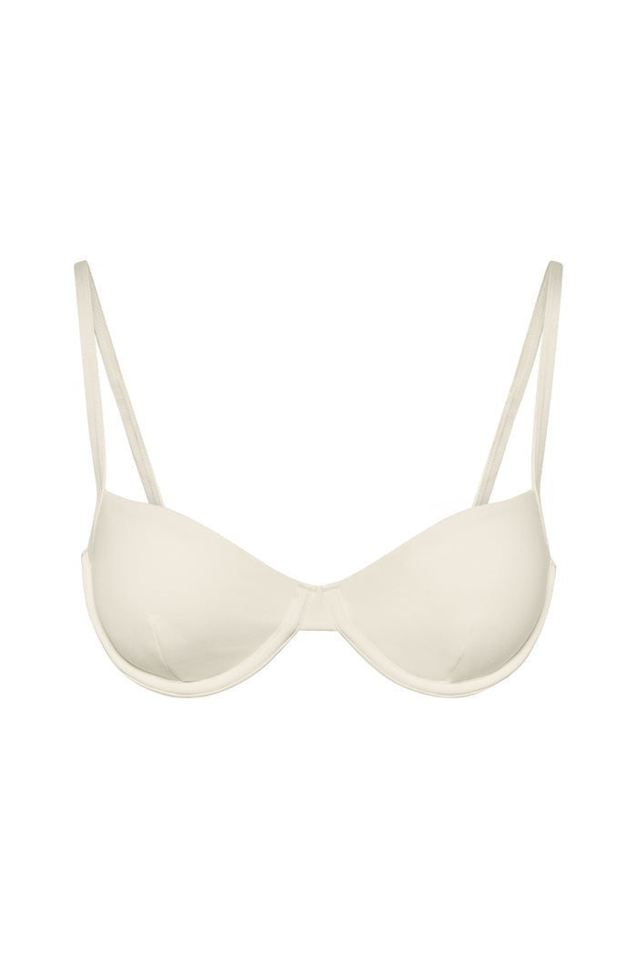 Front view of Capri Top in ivory showcasing underwire molded cups and thin adjustable straps on beige background