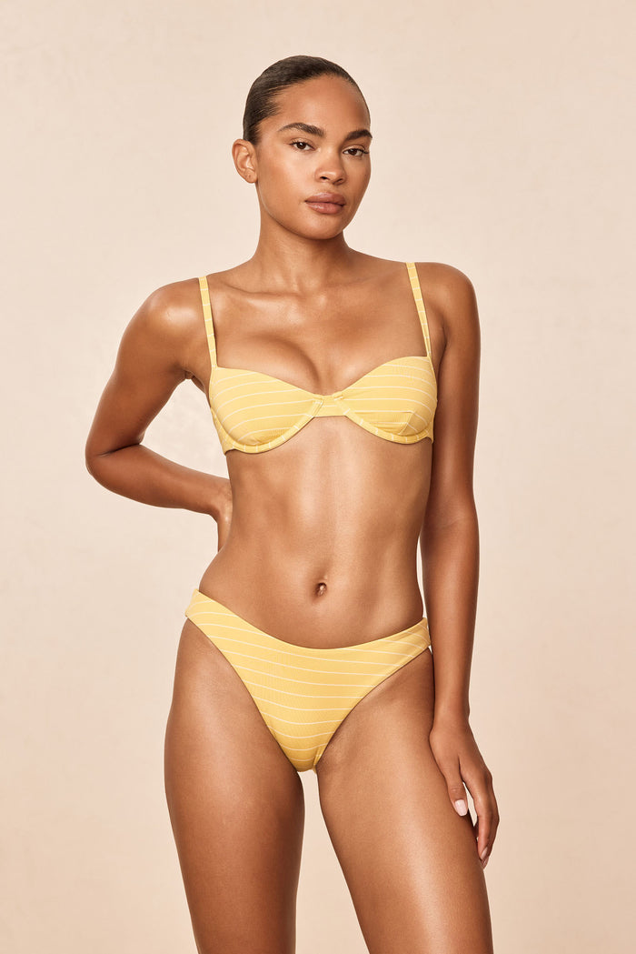 Front view of Capri Top - Meyer Stripe showcasing underwire cups and adjustable straps on a model against a neutral beige studio background