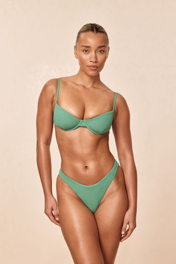 Front view Capri Top in Pond Crinkle, underwire cups, adjustable straps, crinkle texture on model against beige background