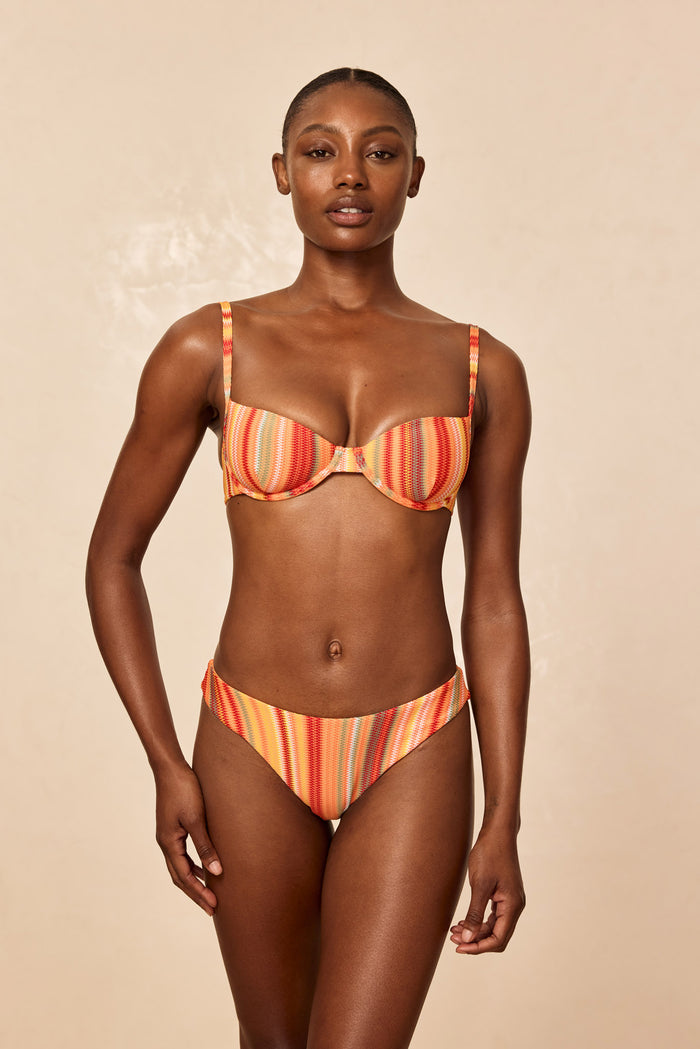 Front view of Byron Bottom in Sardinia Stripe showcasing mid-rise fit and multicolor stripes on a beige studio background