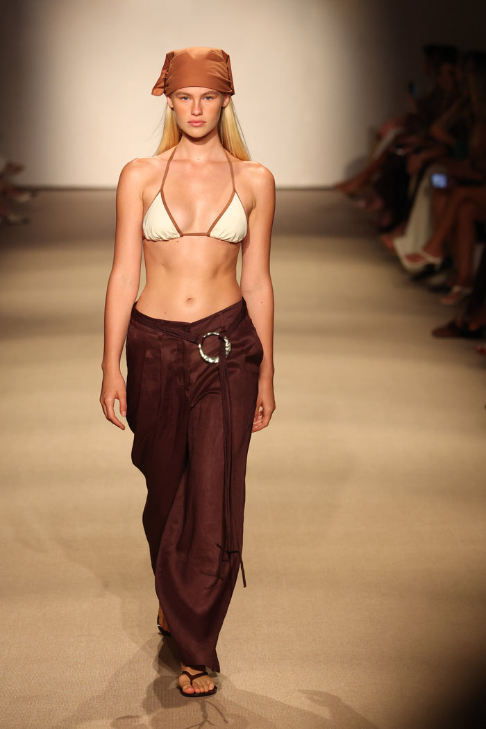Front view of Casablanca Pants in espresso linen on model, relaxed wide-leg fit with metal ring belt on runway