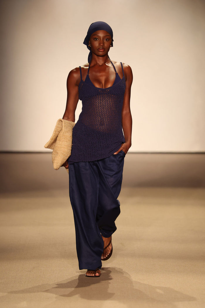 Front view of Casablanca pants in Midnight Linen showcasing relaxed wide-leg fit and side pockets on runway with model