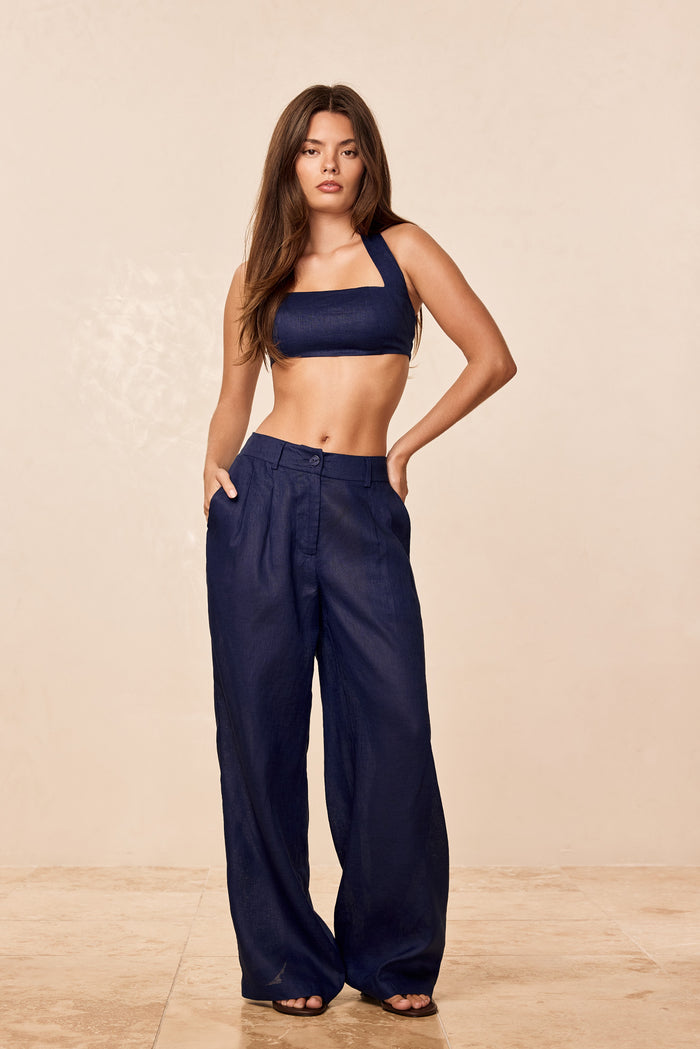 Front view of Casablanca pants in Midnight Linen on model showing high waist, wide-leg fit, front pleats and side pockets