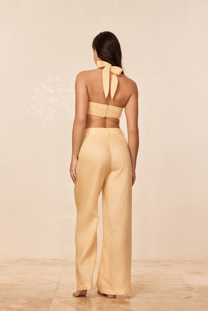 Back view of Casablanca Pants in raffia linen showing high-rise wide-leg fit and textured fabric on neutral background