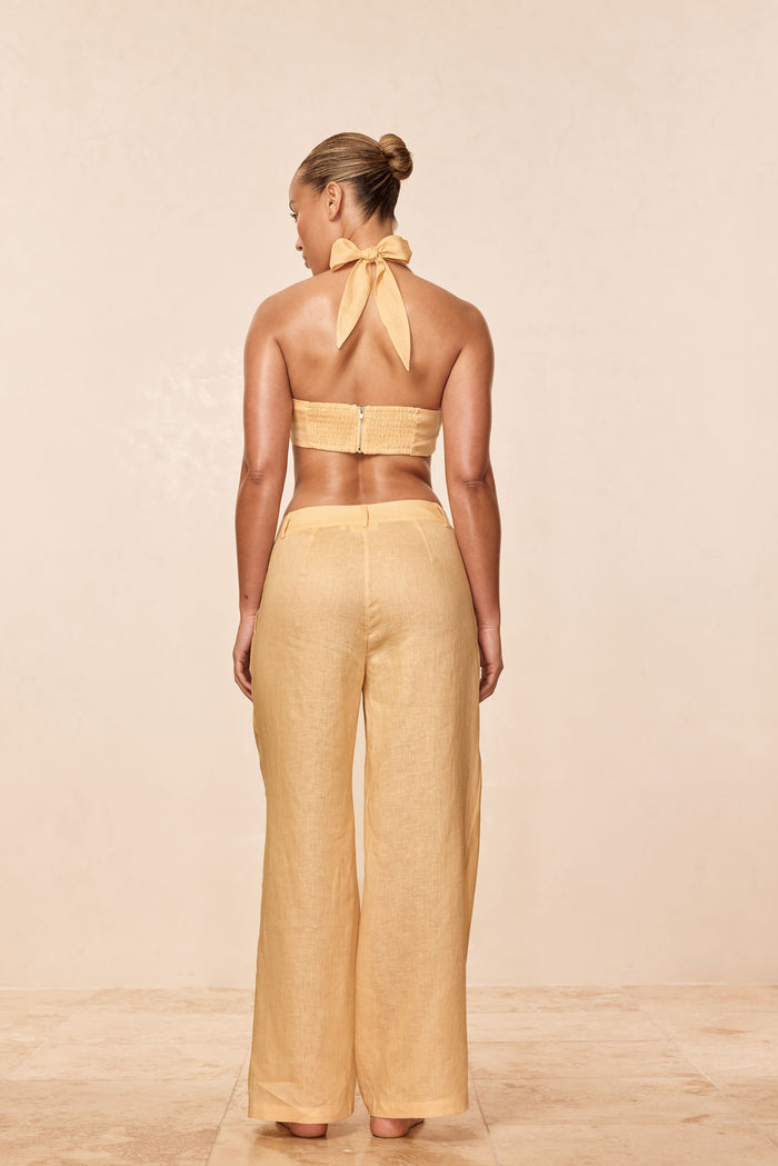 Back view of Casablanca Pants in raffia linen showing wide-leg fit, high back waistband and crinkle texture