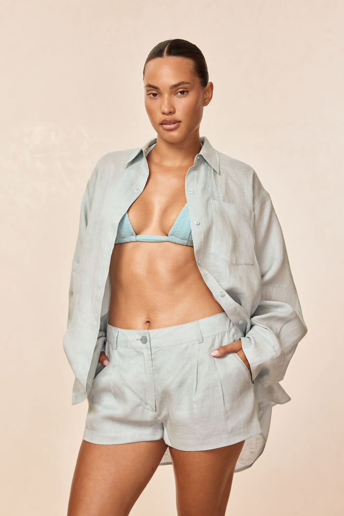 Front view of Casablanca Short in light slate linen on model showing high-rise pleated shorts with side pockets