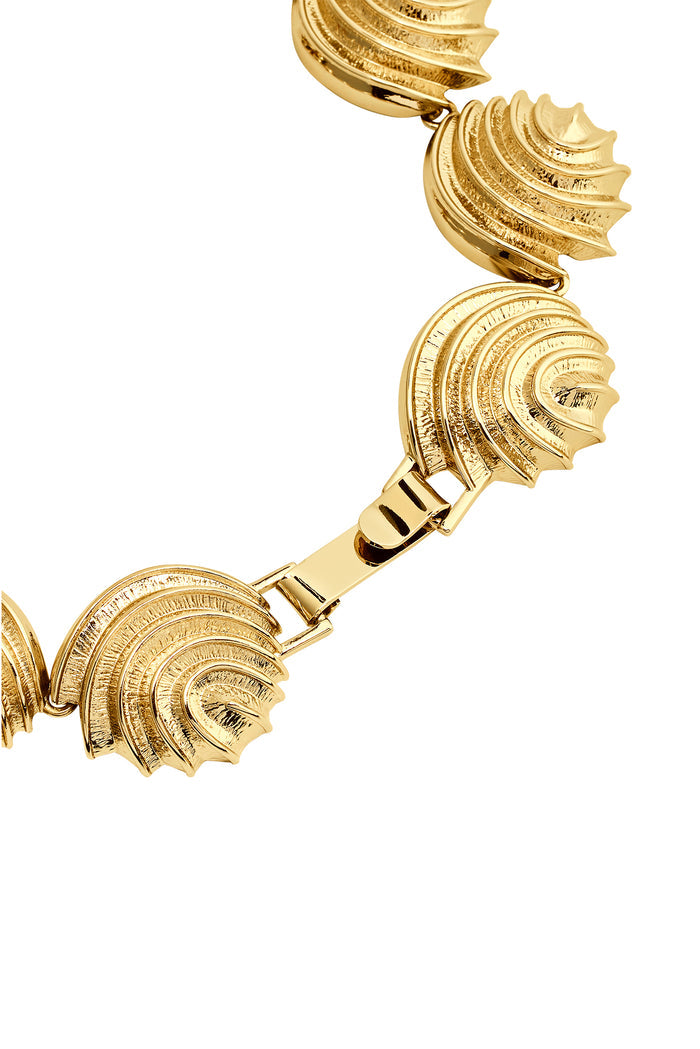 Close-up of Cayman Necklace in gold showcasing scalloped shell links, textured finish, and rectangular clasp on white background