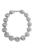 Silver-tone necklace of linked scalloped, textured shell-shaped segments with box clasp