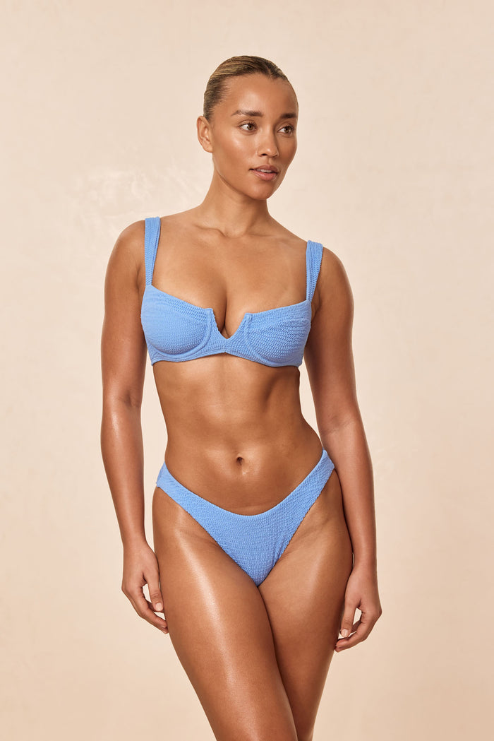 Front view of Clovelly Top in Azure Crinkle showcasing underwire balconette shape and crinkle texture, beige backdrop