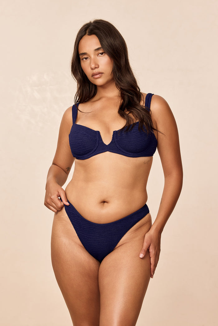 Front view of Clovelly Top in midnight crinkle showing balconette underwire and textured knit on beige background
