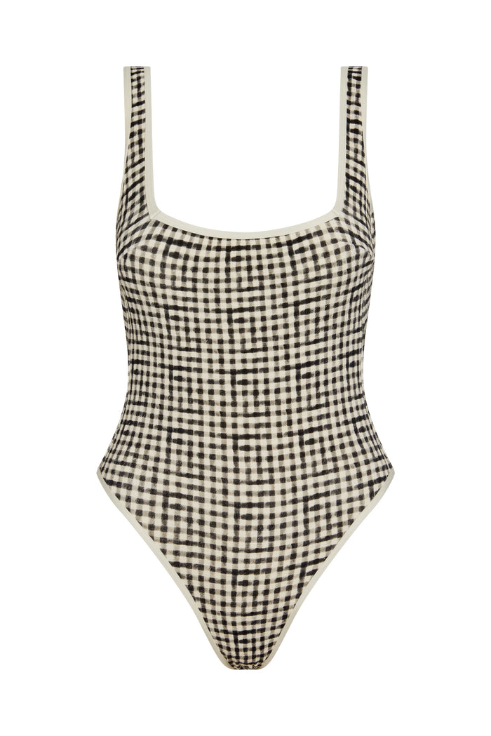 Front view of Corfu One Piece swimsuit in black gingham showcasing square neckline, shelf bra, high-cut leg, and contrast white binding on a white background