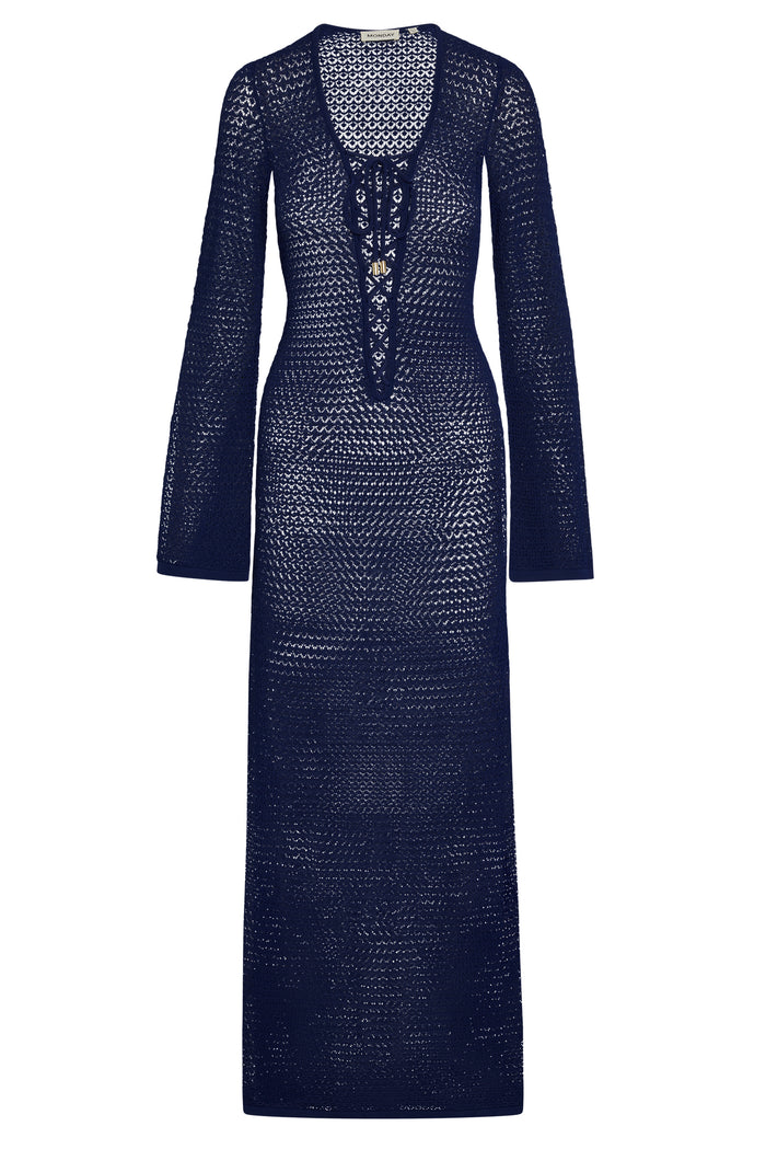 Front view of Corossol Dress in Midnight Lace Crochet showcasing lace up V neck, fitted waist and long sleeves on white background