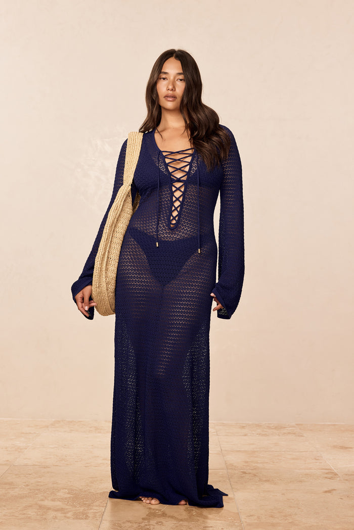Front view of Corossol Dress midnight lace crochet showing lace-up plunging neckline and sheer knit on beige background