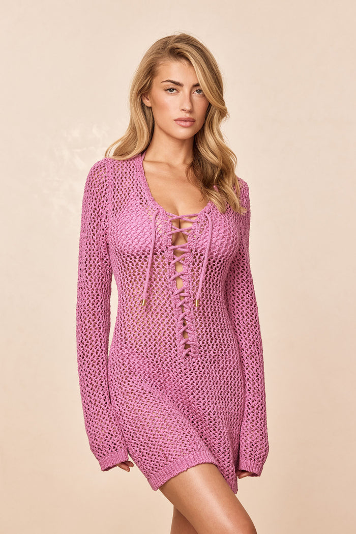 Front of Corossol Mini Dress in Moonlight showing lace-up plunging neckline and sheer crochet knit on beige background