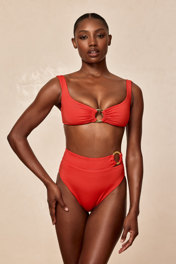 Front view of Costa Rica bottom in Chili Pepper showing high-waist coverage and gold ring hardware, neutral background