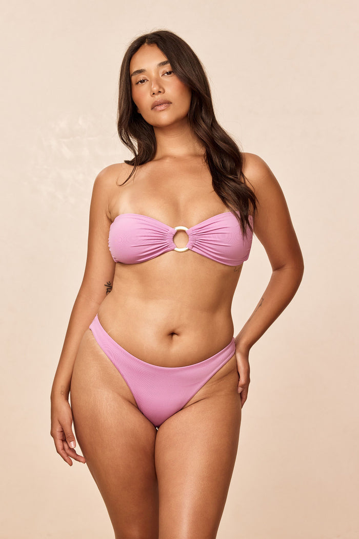 Front view of Costa Rica Top in Moonlight showcasing bandeau fit and gold center ring with removable padding and adjustable back tie on beige background
