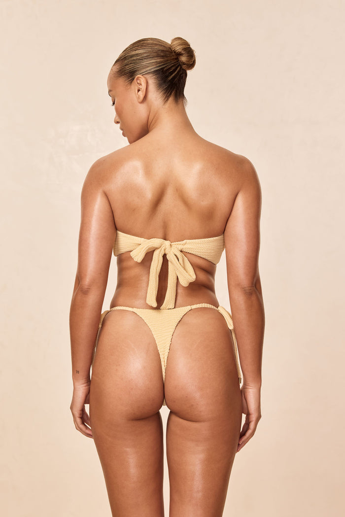 Back view of Costa Rica Top Raffia Crinkle showing tie back bandeau and crinkled raffia texture with studio background