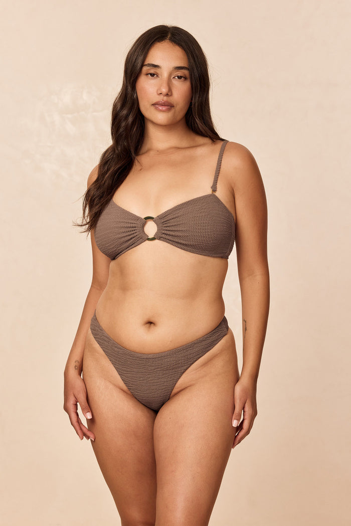 Front view of Costa Rica Top in stone crinkle on model, bandeau with ring, removable halter and adjustable back tie