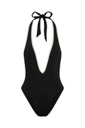 Black halter one-piece swimsuit with deep V neckline, contrast white binding and tied neck bow.