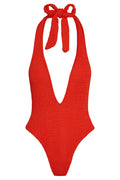 Front view of Cyprus one-piece in Chili Pepper crinkle with deep V halter, tie straps, and textured fabric on white background